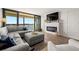 Spacious living room with fireplace and water views at 9525 Blind Pass Rd # 507, St Pete Beach, FL 33706