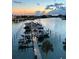 Boats docked at a marina at sunrise at 9525 Blind Pass Rd # 507, St Pete Beach, FL 33706