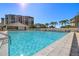 Inviting community swimming pool with ample deck space at 9525 Blind Pass Rd # 507, St Pete Beach, FL 33706