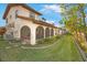 Spacious backyard with screened patio and lush landscaping at 9649 Wilsky Blvd # 3, Tampa, FL 33615