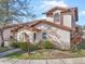 Two-story home with terracotta roof and manicured landscaping at 9649 Wilsky Blvd # 3, Tampa, FL 33615