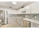 Updated kitchen with stainless steel appliances and a breakfast nook at 9649 Wilsky Blvd # 3, Tampa, FL 33615