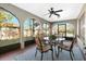 Relaxing screened porch with patio furniture and view of the backyard at 9649 Wilsky Blvd # 3, Tampa, FL 33615