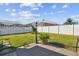 Spacious backyard with grassy area, stone patio, and privacy fence at 10338 Meadow Crossing Dr, Tampa, FL 33647