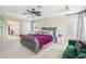 Main bedroom with king-size bed and sitting area at 10414 Lucaya Dr, Tampa, FL 33647