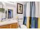 Bathroom featuring a vanity, commode and blue and yellow shower curtain at 10601 Shady Falls Ct, Riverview, FL 33578