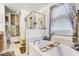 Bright bathroom with soaking tub, glass-enclosed shower, and elegant decor at 10601 Shady Falls Ct, Riverview, FL 33578