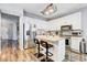 Modern kitchen with stainless steel appliances, light countertops, and a center island at 10601 Shady Falls Ct, Riverview, FL 33578