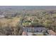 Aerial view showing home's location in wooded community at 10883 Dragonwood Dr, Tampa, FL 33647