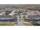 Aerial view of community with pond and townhomes at 10883 Dragonwood Dr, Tampa, FL 33647