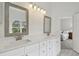 Bright bathroom boasts double vanity and views into bedroom at 10883 Dragonwood Dr, Tampa, FL 33647