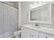 Clean bathroom with white vanity and shower/tub combo at 10883 Dragonwood Dr, Tampa, FL 33647