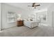 Main bedroom with window and ceiling fan at 10883 Dragonwood Dr, Tampa, FL 33647