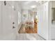 Bright and airy entryway with hardwood floors and view to dining area at 10883 Dragonwood Dr, Tampa, FL 33647
