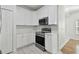 Modern kitchen with stainless steel appliances and white cabinets at 10883 Dragonwood Dr, Tampa, FL 33647