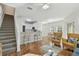 Open living room with kitchen island and stairs at 10883 Dragonwood Dr, Tampa, FL 33647