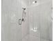 Large walk-in shower with marble tile and glass enclosure at 10883 Dragonwood Dr, Tampa, FL 33647