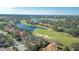 Aerial view of the house and surrounding golf course community at 1109 Toscano Dr, Trinity, FL 34655