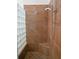 Large walk-in shower with tiled walls and built-in seat at 1109 Toscano Dr, Trinity, FL 34655