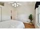 Bedroom with ceiling fan and door to another room at 11411 Turtle Dove Pl, New Port Richey, FL 34654