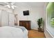 Bedroom with wood floors, large window and dresser at 11411 Turtle Dove Pl, New Port Richey, FL 34654
