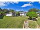 Well-maintained lawn, landscaping, and curb appeal at 11411 Turtle Dove Pl, New Port Richey, FL 34654