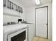 Laundry room with washer, dryer, and exterior access at 11411 Turtle Dove Pl, New Port Richey, FL 34654