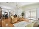 Relaxing living room with hardwood floors and access to a back patio at 11411 Turtle Dove Pl, New Port Richey, FL 34654