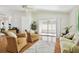 Comfortable living room with two armchairs, a sofa and hardwood floors at 11411 Turtle Dove Pl, New Port Richey, FL 34654