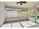 Sunroom with tiled floor and windows overlooking yard at 11411 Turtle Dove Pl, New Port Richey, FL 34654