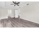 Bright bedroom with wood-look floors and access to other rooms at 12332 Harris Hawk Rd, Weeki Wachee, FL 34614
