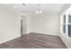 Spacious dining area with hardwood floors and large window at 12332 Harris Hawk Rd, Weeki Wachee, FL 34614
