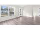Light and airy entryway with wood-look floors and glass door at 12332 Harris Hawk Rd, Weeki Wachee, FL 34614