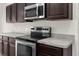 Stainless steel appliances in this modern kitchen at 12332 Harris Hawk Rd, Weeki Wachee, FL 34614