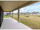 Covered patio overlooking expansive backyard at 12795 Fisherville Way, Riverview, FL 33579