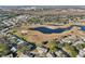 Aerial view of community with homes, golf course, and lake at 1312 Leland Dr # 61, Sun City Center, FL 33573