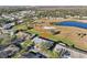 Aerial view of house and surrounding golf course community at 1312 Leland Dr # 61, Sun City Center, FL 33573