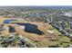 Aerial perspective of a community with a pond and golf course at 1312 Leland Dr # 61, Sun City Center, FL 33573