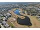 Aerial image showing a community near a golf course and pond at 1312 Leland Dr # 61, Sun City Center, FL 33573