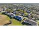 Aerial view of a residential area featuring houses and green spaces at 1312 Leland Dr # 61, Sun City Center, FL 33573