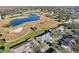 Aerial view of house and surrounding golf course community at 1312 Leland Dr # 61, Sun City Center, FL 33573