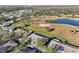 Aerial view of house and surrounding golf course community at 1312 Leland Dr # 61, Sun City Center, FL 33573