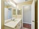 Bathroom with vanity, mirror and access to another room at 1312 Leland Dr # 61, Sun City Center, FL 33573