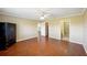 Well-lit bedroom with hardwood floors and access to bathroom at 1312 Leland Dr # 61, Sun City Center, FL 33573