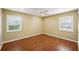 Spacious bedroom with wood floors and window shutters at 1312 Leland Dr # 61, Sun City Center, FL 33573