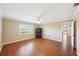 Bright bedroom with wood floors and access to another room at 1312 Leland Dr # 61, Sun City Center, FL 33573