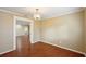 Dining room with wood floors and view of living room at 1312 Leland Dr # 61, Sun City Center, FL 33573