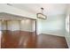 Dining room with hardwood floors, light walls, and access to the back patio at 1312 Leland Dr # 61, Sun City Center, FL 33573