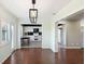 Dining room with hardwood floors and a view into the updated kitchen at 1312 Leland Dr # 61, Sun City Center, FL 33573