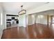 Bright dining room with hardwood floors, light walls, and a view into the kitchen at 1312 Leland Dr # 61, Sun City Center, FL 33573